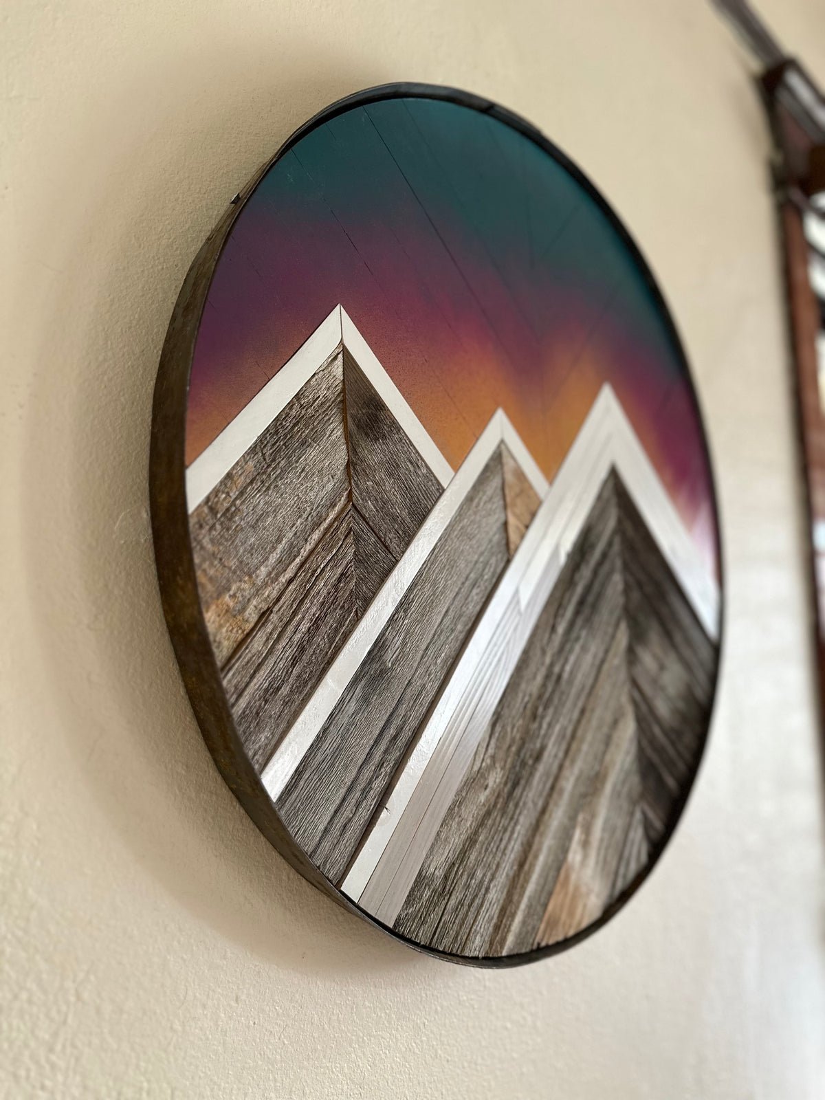 Sunrise Peaks Round Reclaimed Cedar Mosaic, framed in vintage whiskey barrel ring